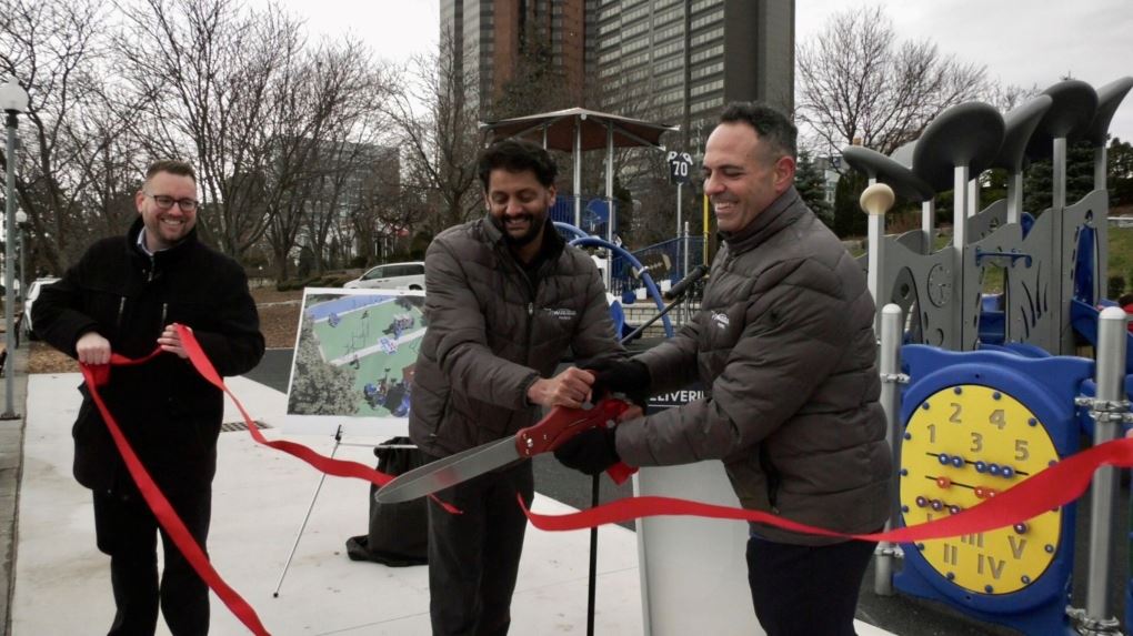 Mark McKenzie, left, at a community park ribbon-cutting ceremony